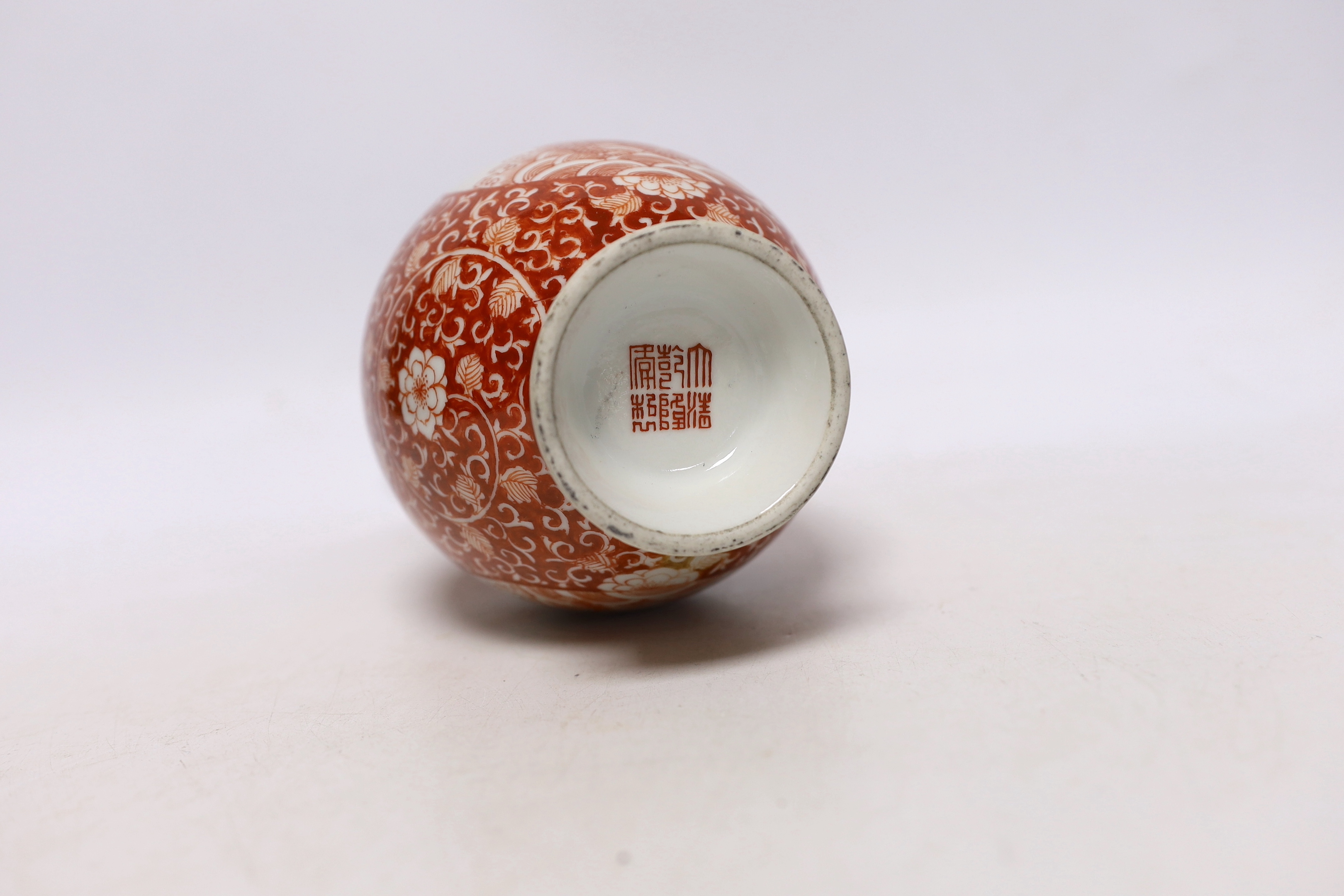 A Chinese iron red enamelled 'mythical beast' vase, early 20th century, 21cm high